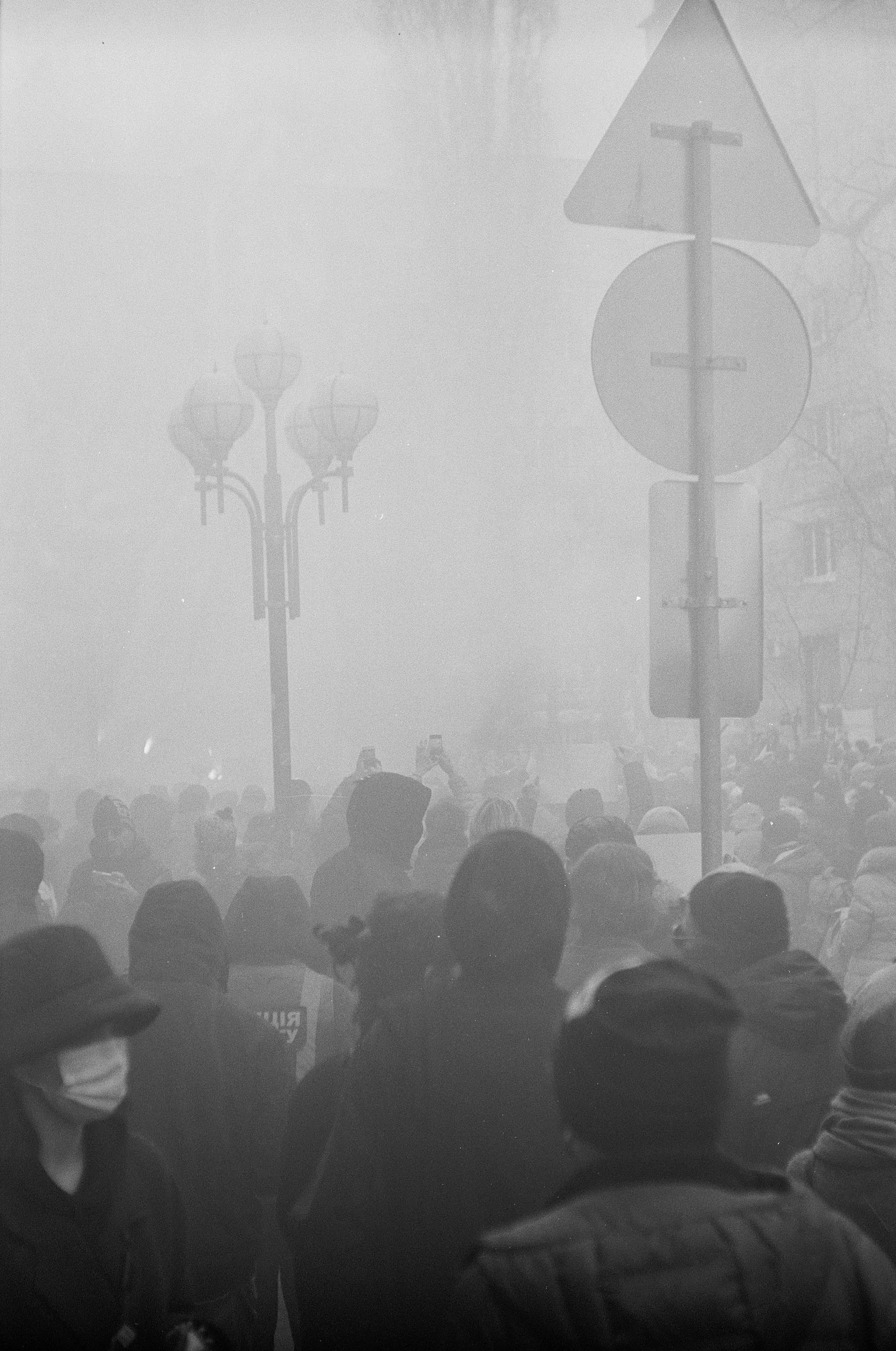 grayscale photo of people standing on stage