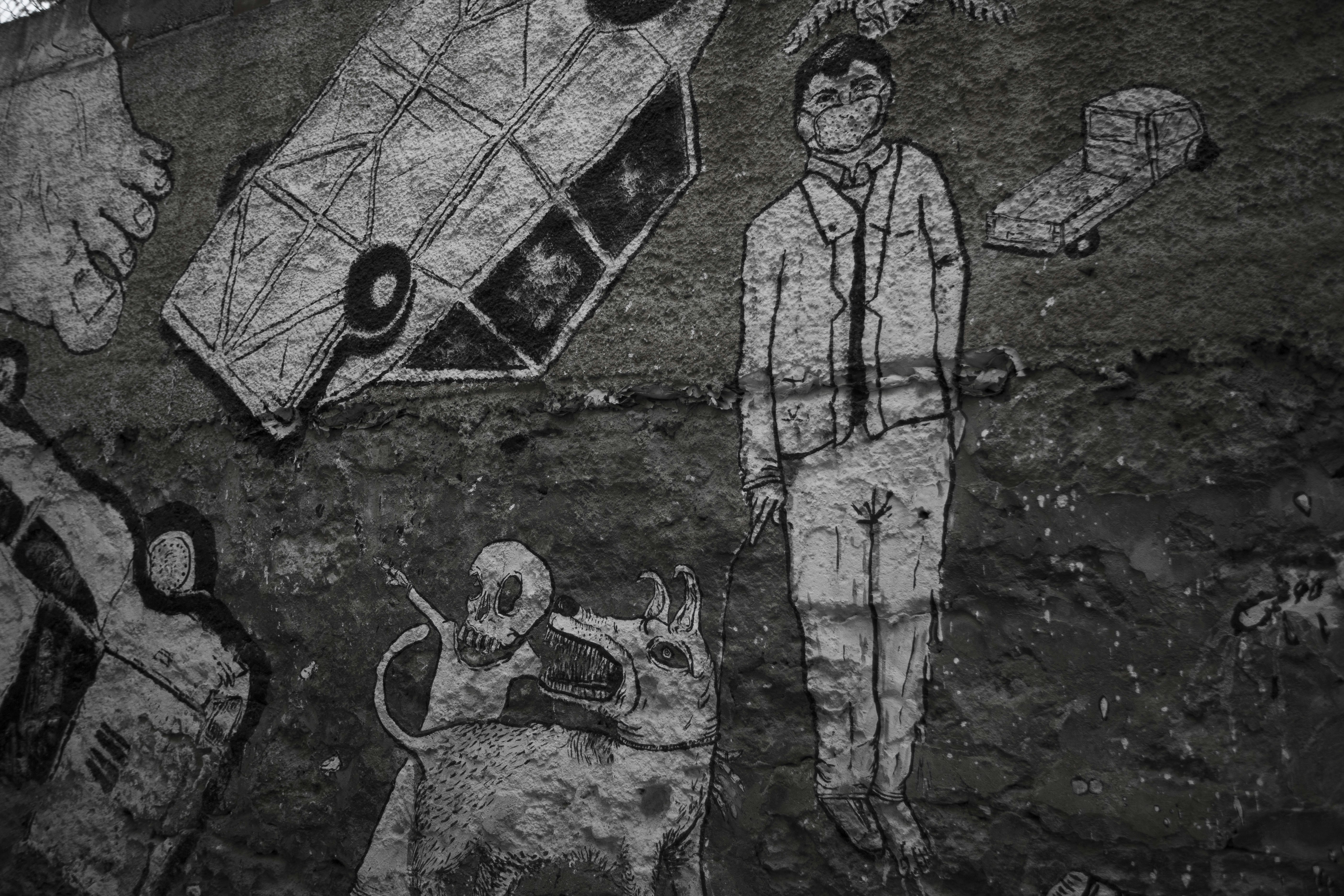 man in gray coat holding umbrella painting