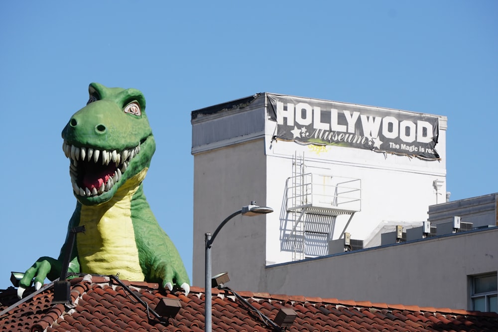 green frog plush toy on roof