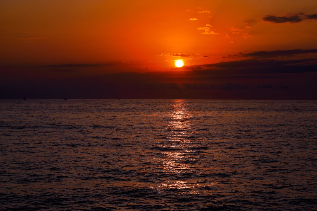 body of water during sunset