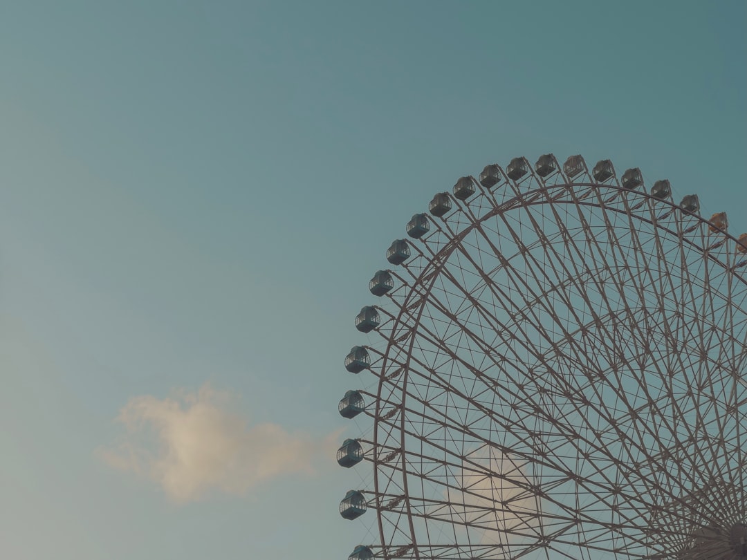 white ferris wheel under blue sky during daytime