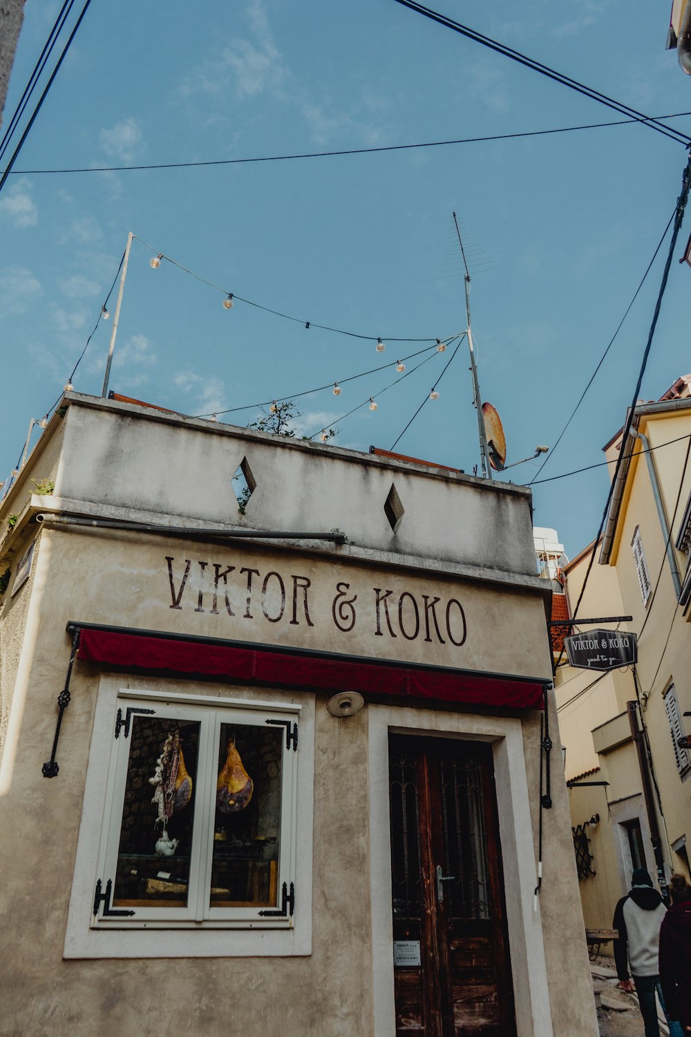 a building with a sign that says victch & koko on it