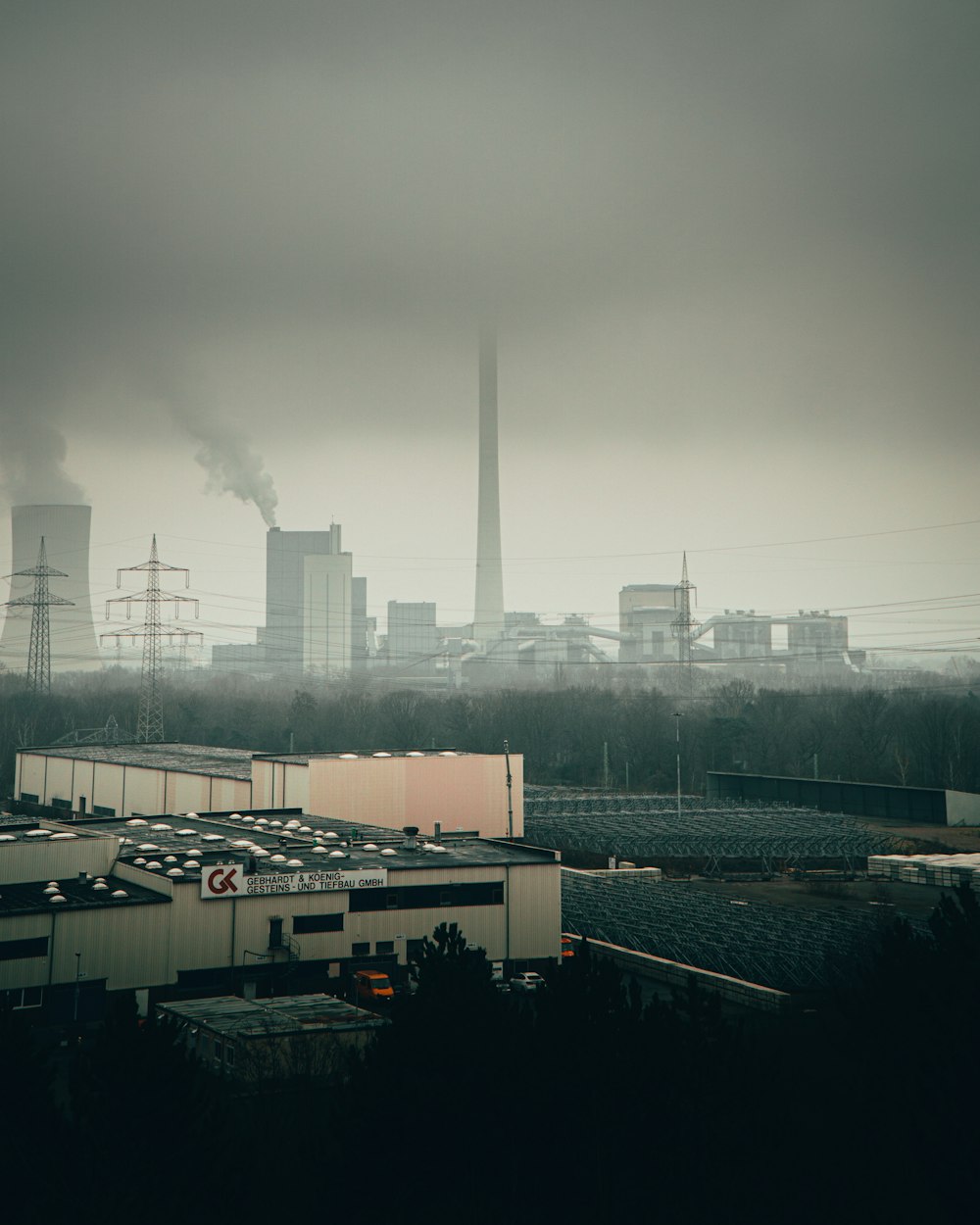 white and black concrete building under white clouds during daytime