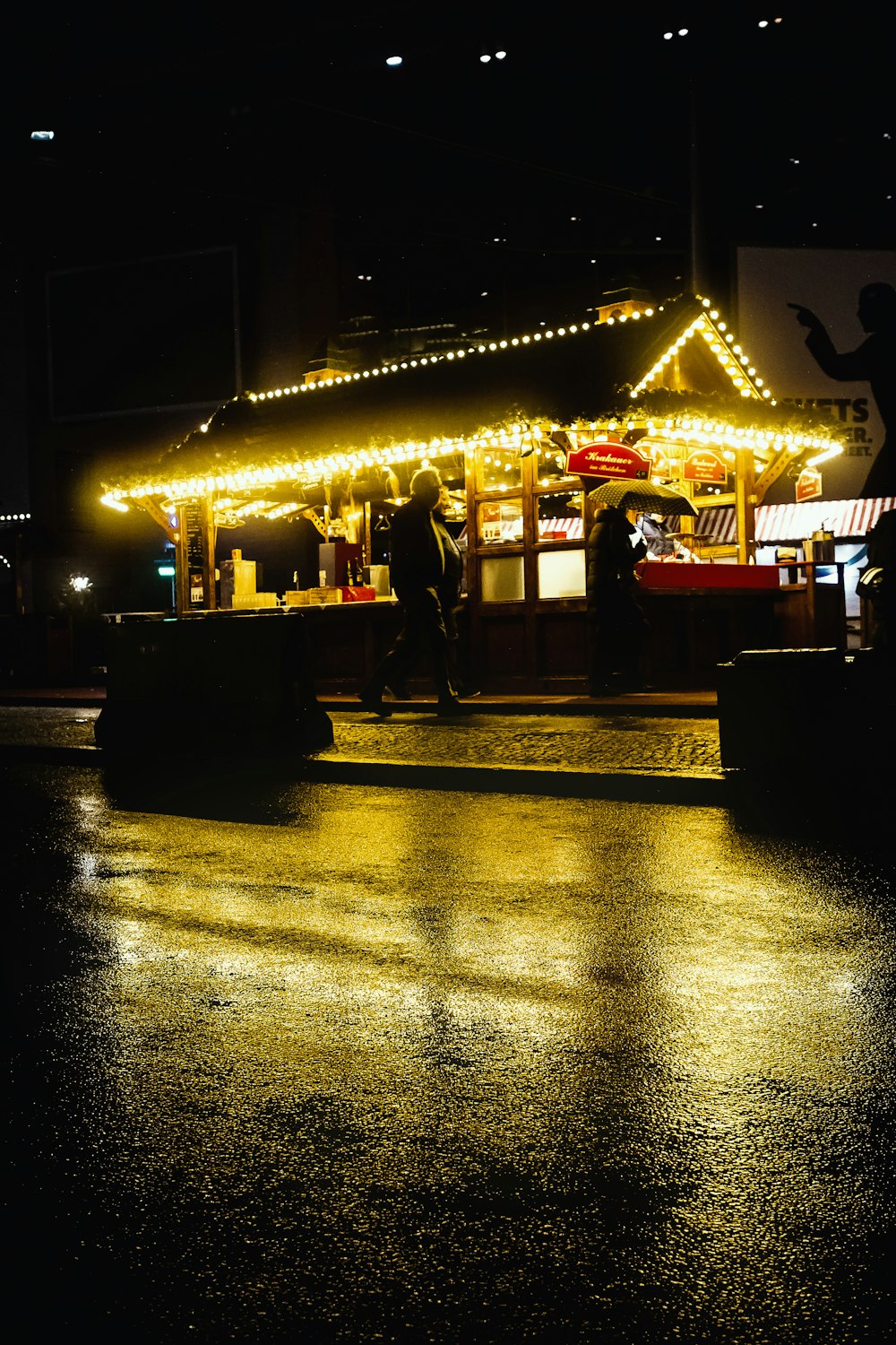 people standing near store during night time