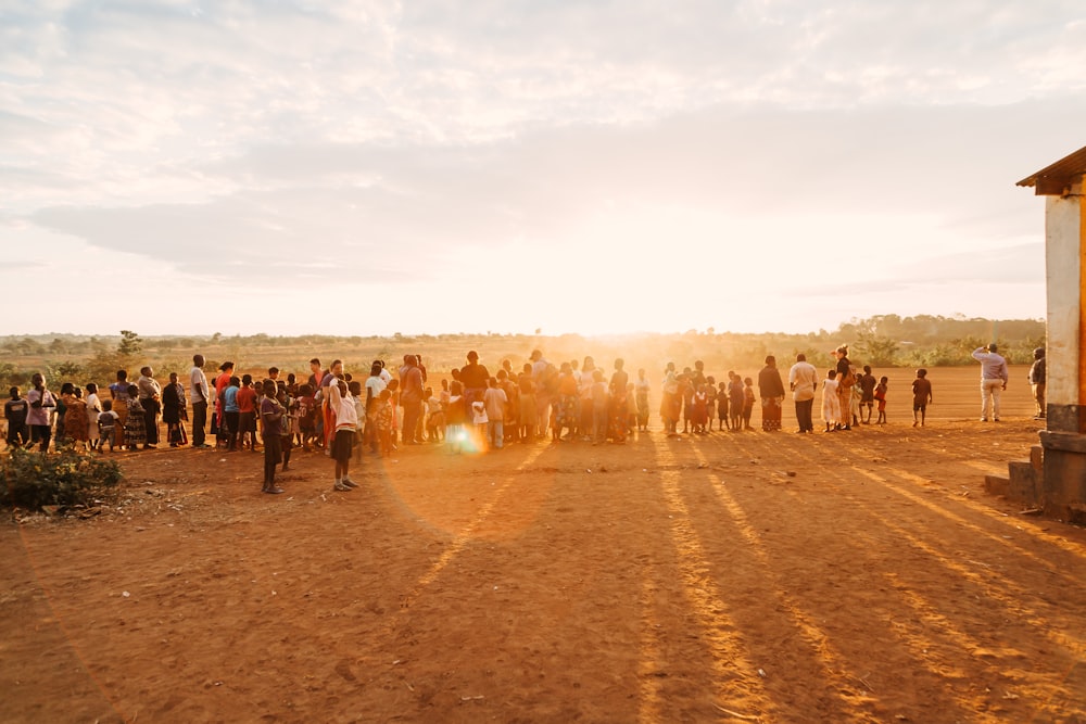 people on brown sand during daytime