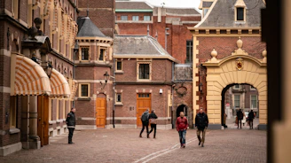 people walking outside the Binnenhof at The Hague