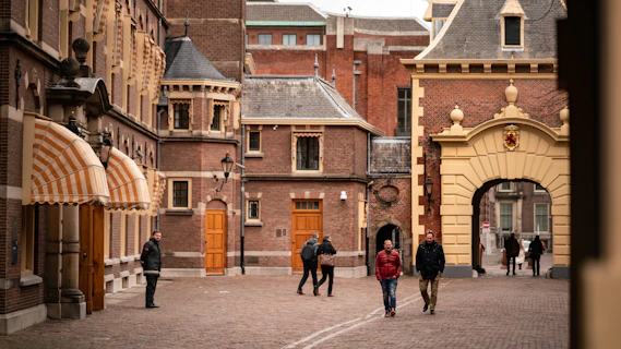 people walking outside the Binnenhof at The Hague