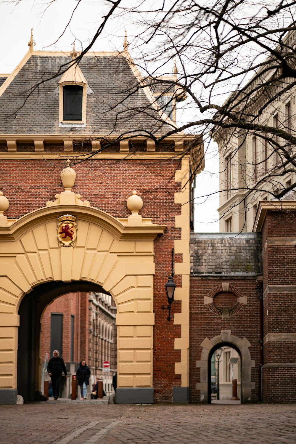 brown brick building with brown wooden door