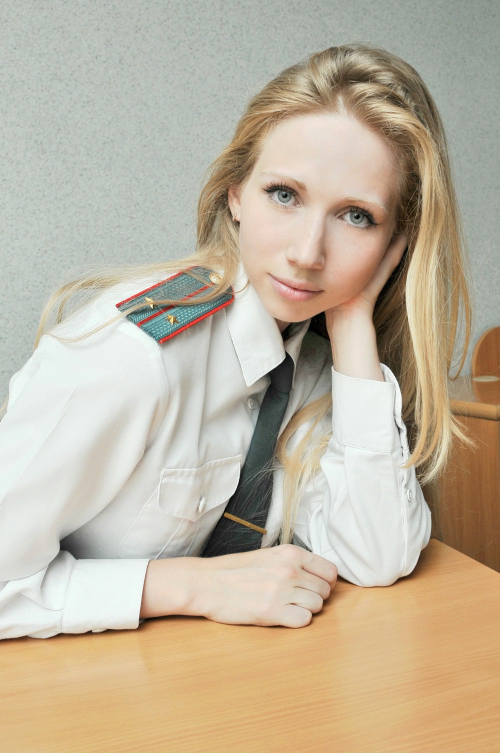 woman in white coat sitting on chair