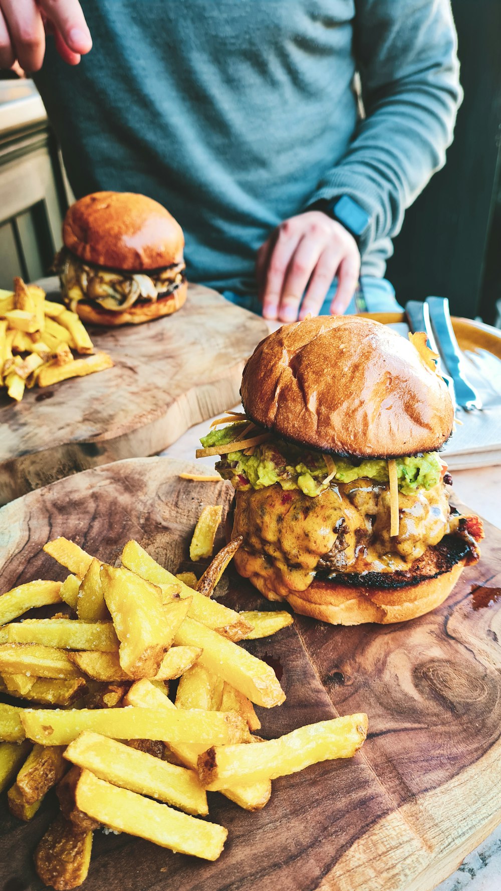 burger and fries on white paper