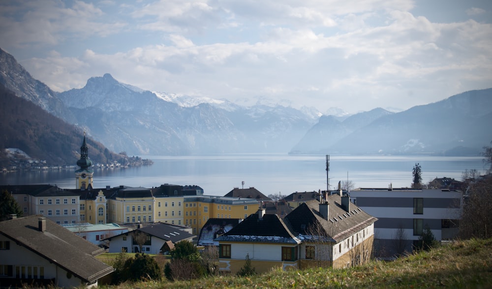 white and brown concrete houses near mountain during daytime