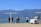 Group of tourists exploring a scenic destination with luggage.