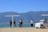 Group of tourists exploring a scenic destination with luggage.