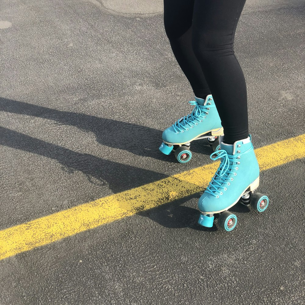 woman in blue nike sneakers and black leggings