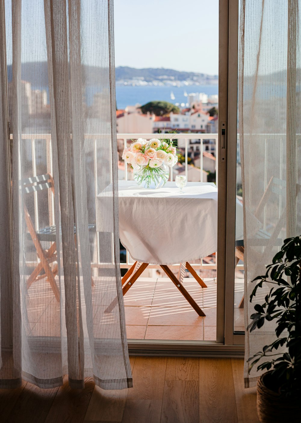 white and brown wooden chair near white table