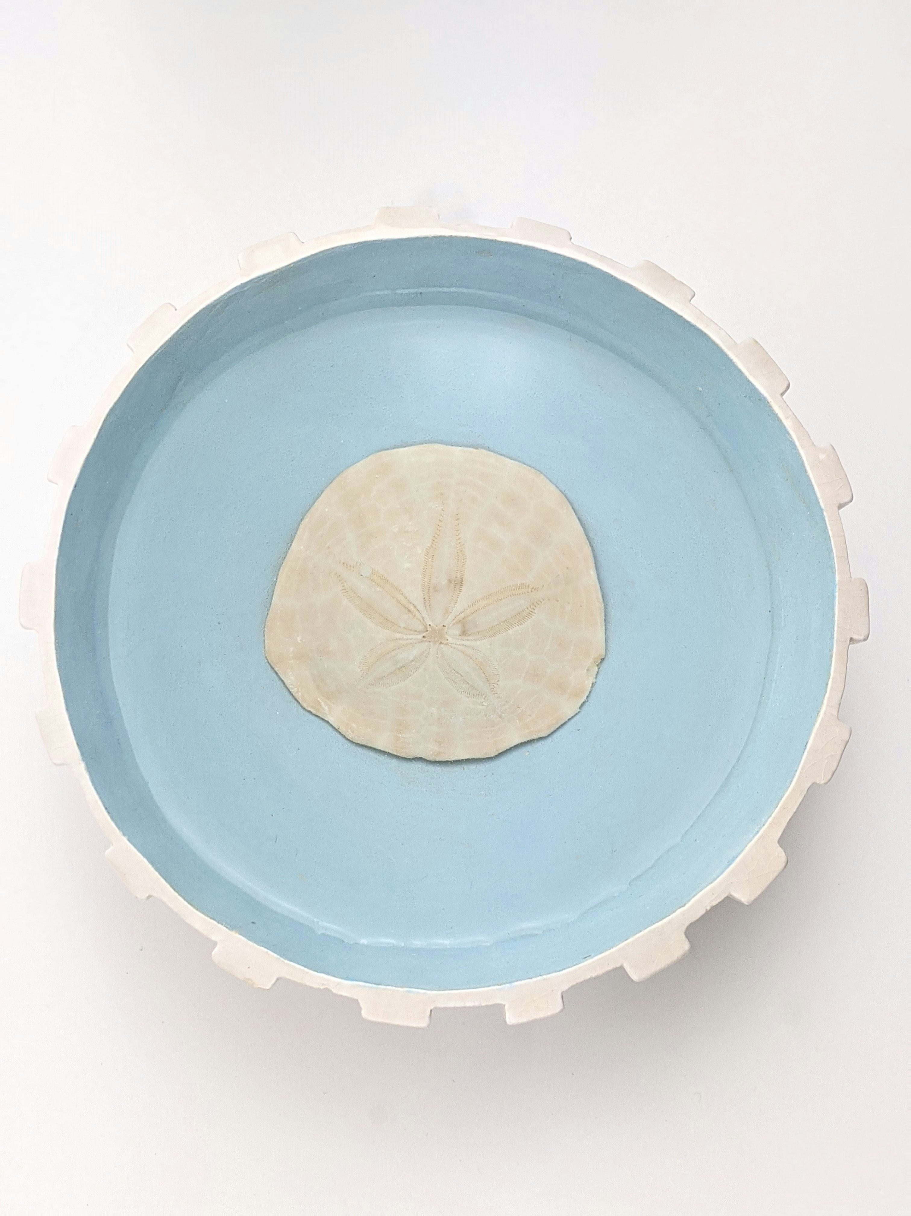 blue and white round plate
