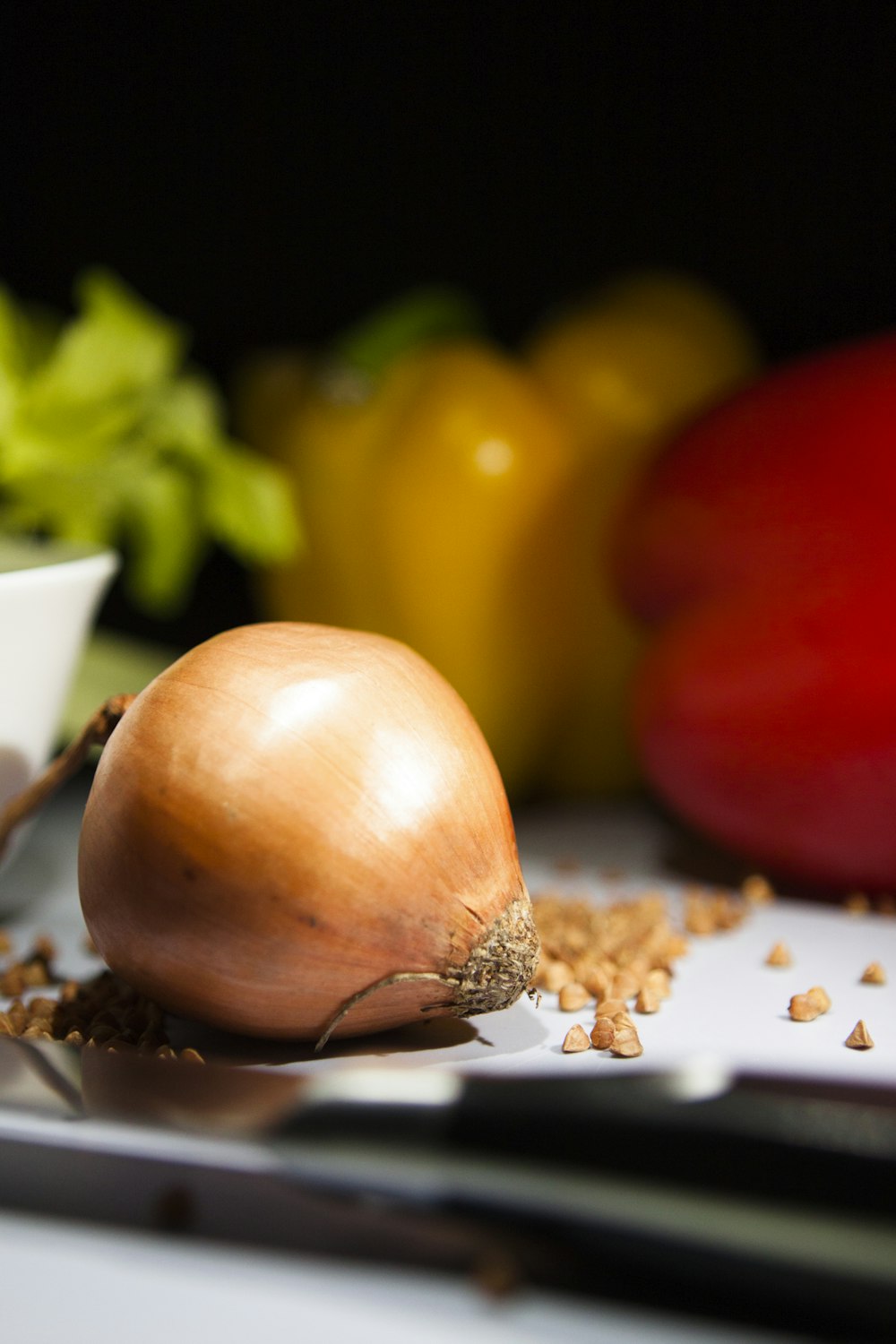 brown onion on white paper