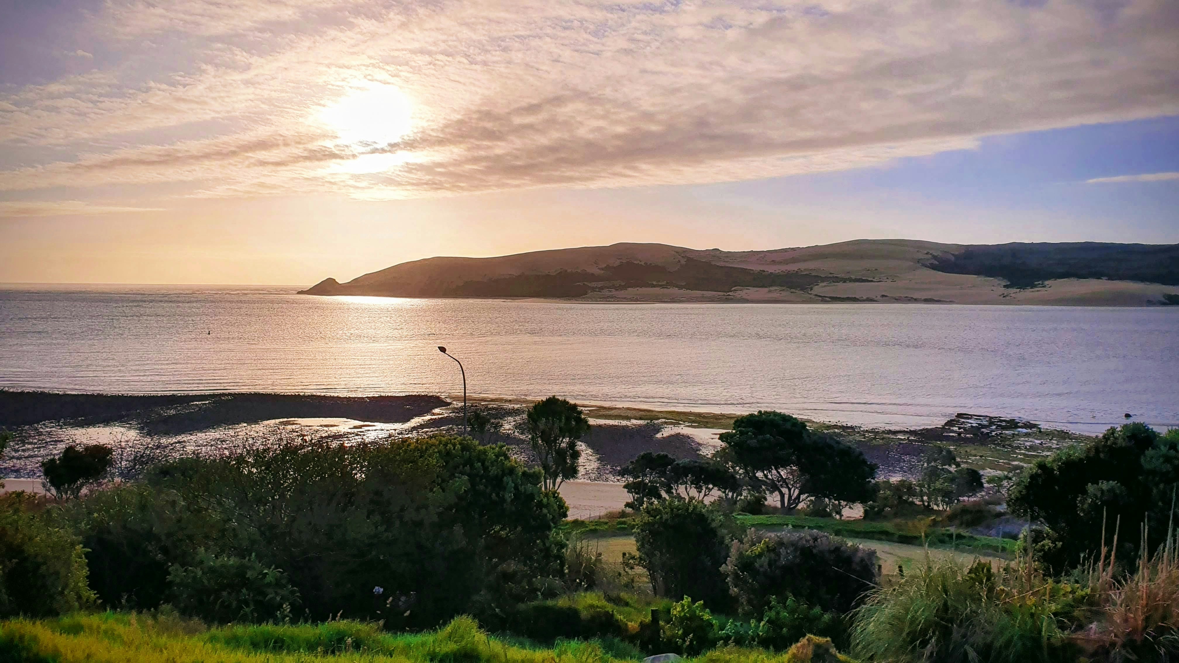 Golden hour travel photography, warm landscape with soft light, Mediterranean countryside