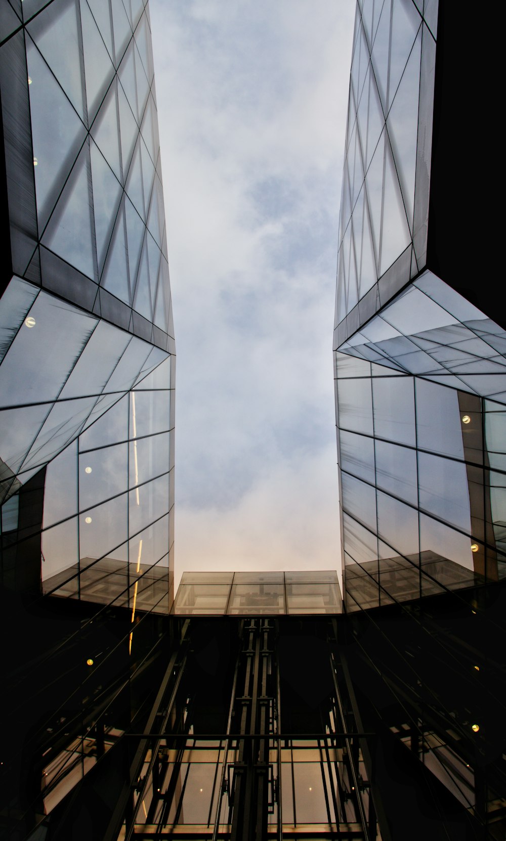 gray and black building under gray clouds