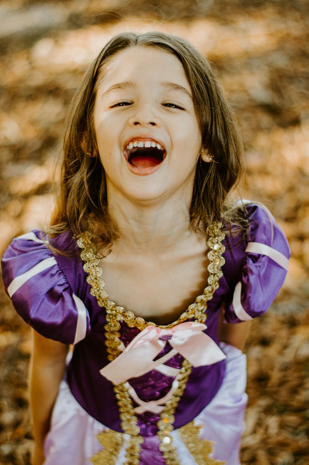 girl in purple and yellow dress