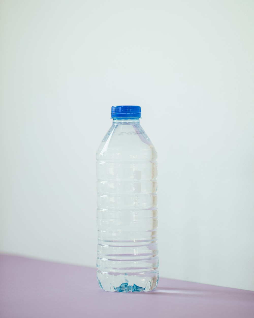 clear plastic bottle on white table