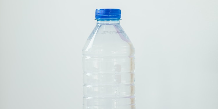 clear plastic bottle on white table