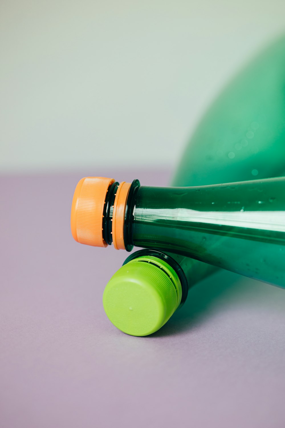 green bottle with yellow cap