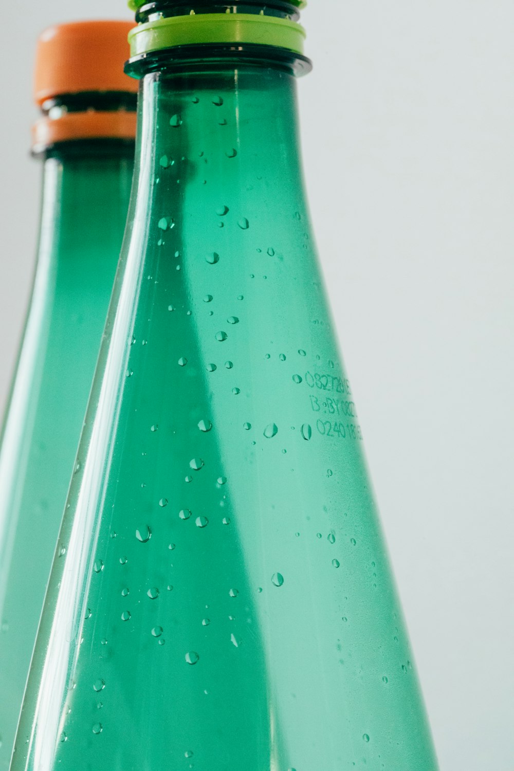 teal and brown bottle with white background
