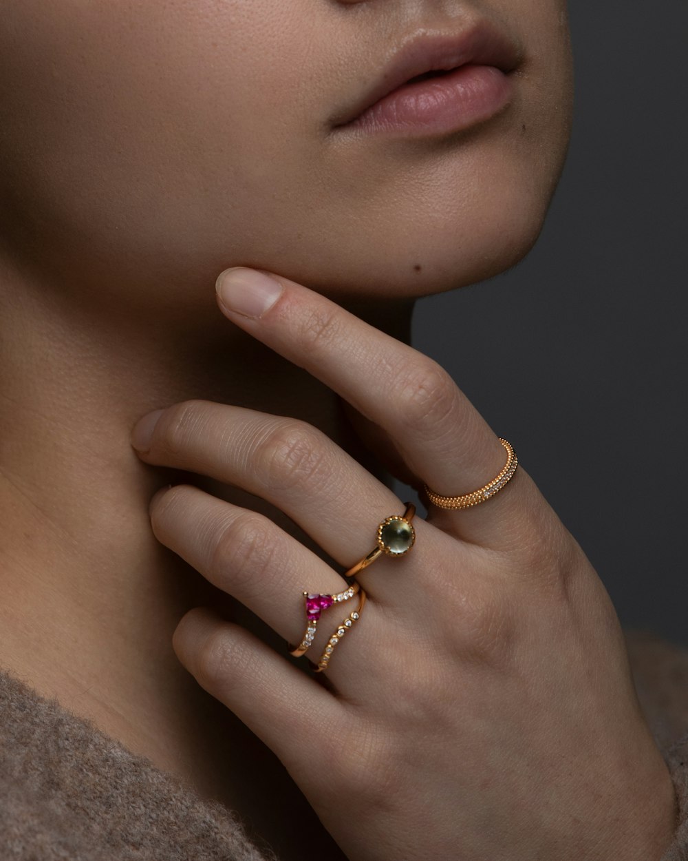 woman wearing gold and diamond ring