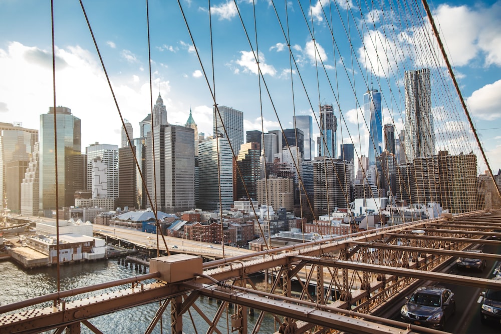 brown metal bridge over the city during daytime