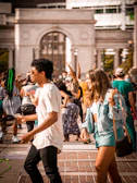 Volunteers handing out flyers in a busy Ohio town square, engaging with curious passersby.