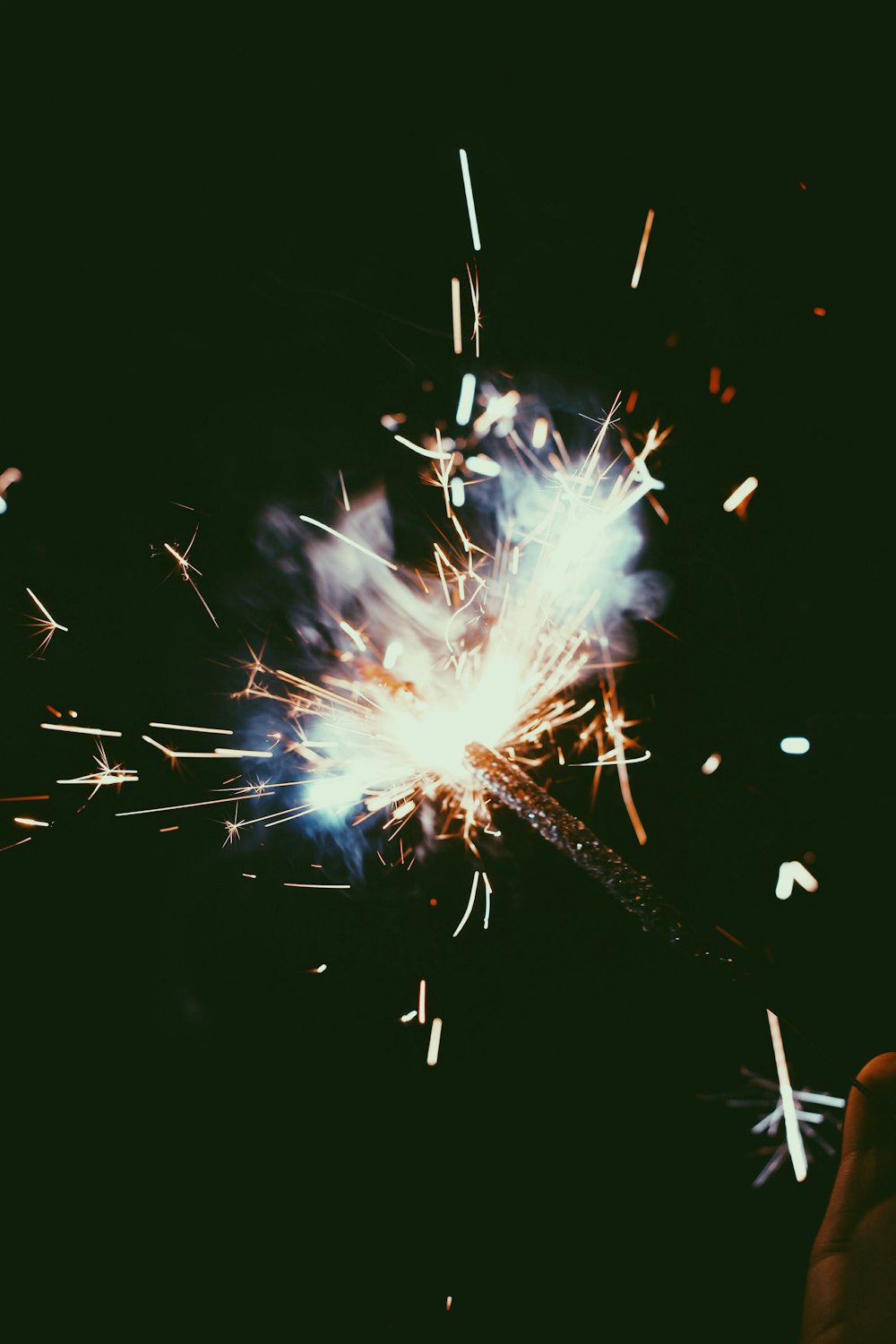 white and brown fireworks in the sky