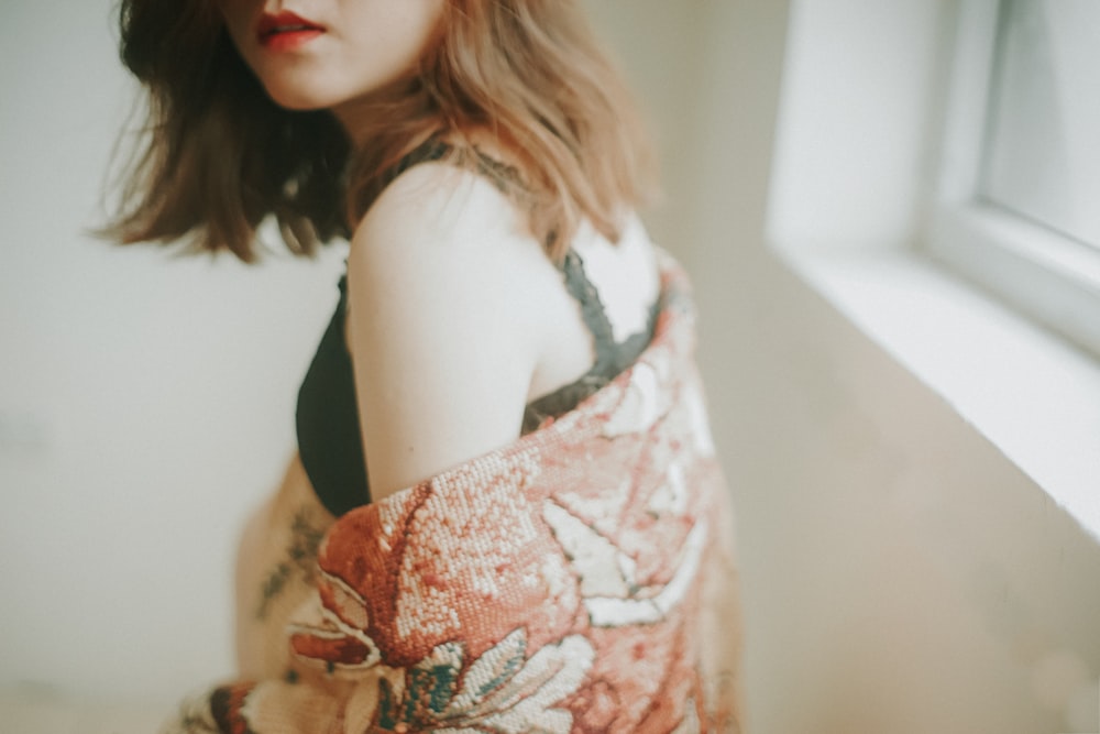 woman in white and red floral dress