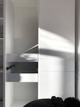 Close-up of a craftsman carefully assembling a custom cabinet in a Nevada workshop.