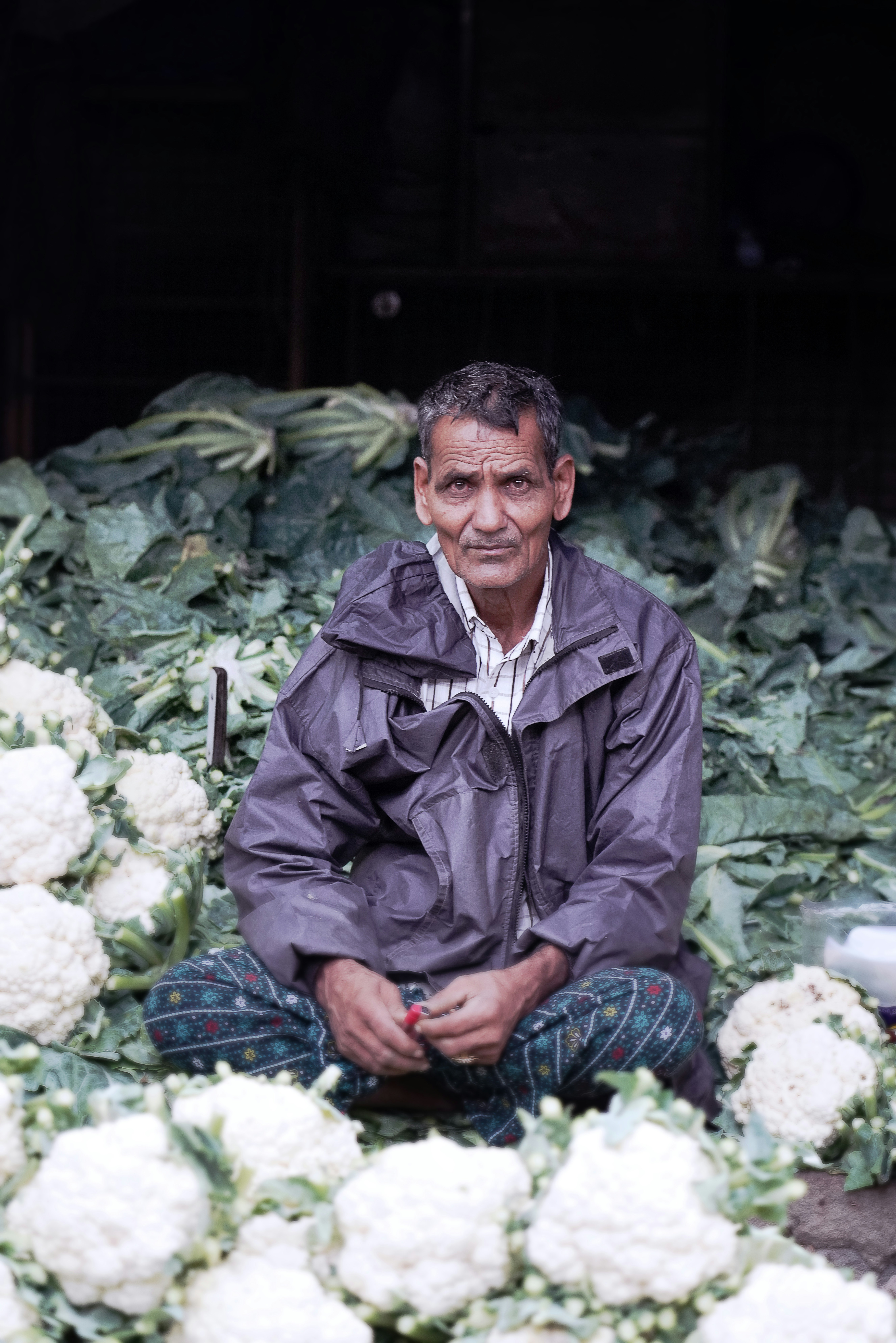 man in gray jacket sitting on chair