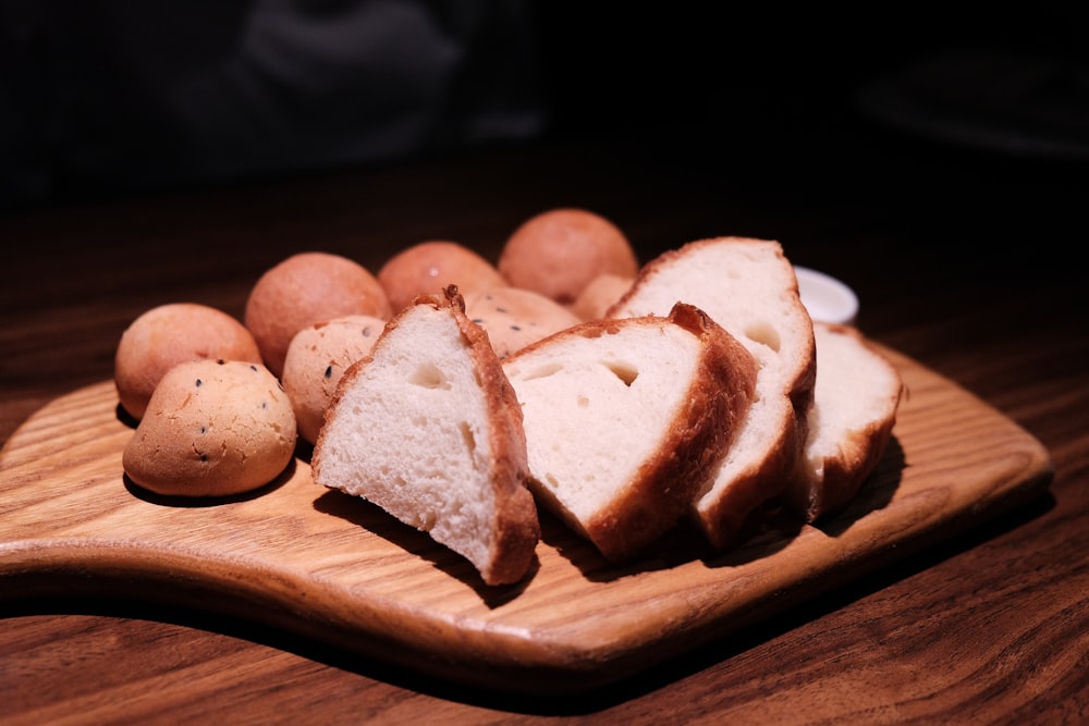 sliced bread on brown wooden chopping board