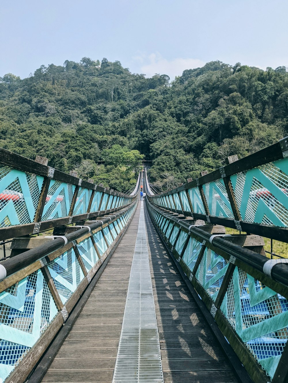 brown wooden bridge over river