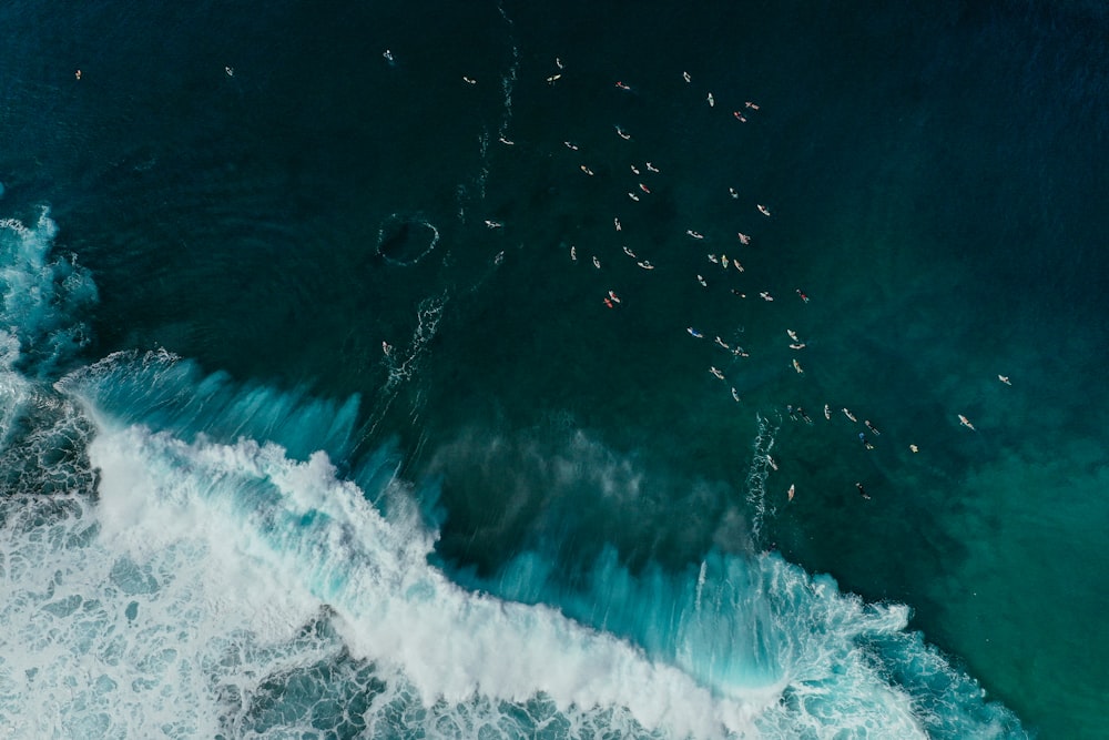 water waves on blue ocean water during daytime