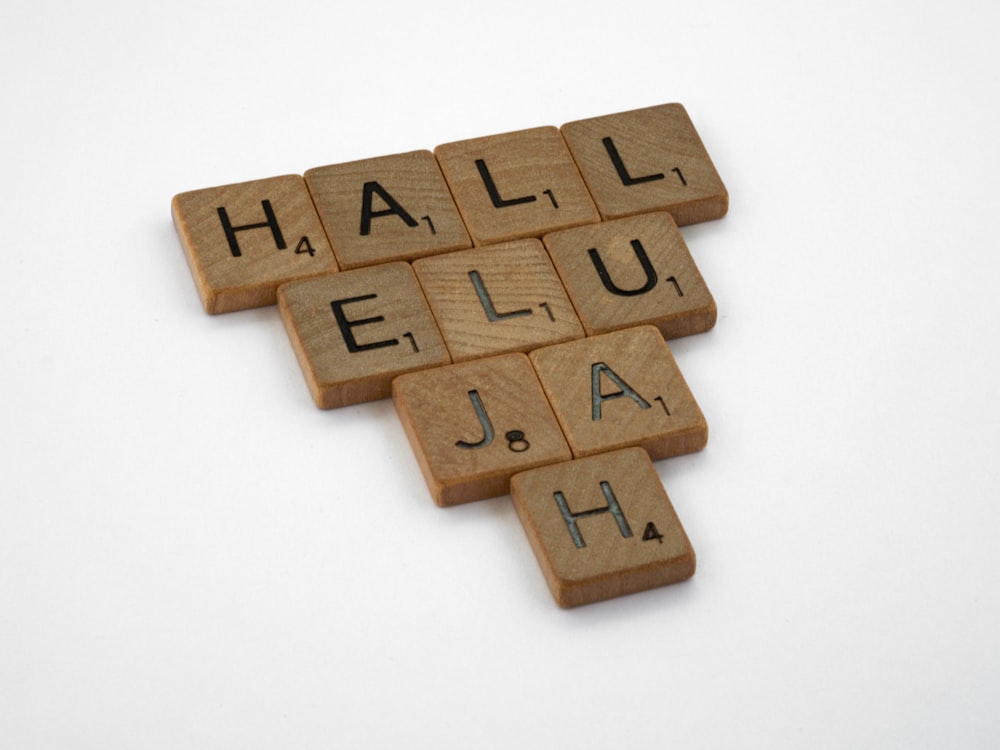 brown wooden puzzle blocks on white surface