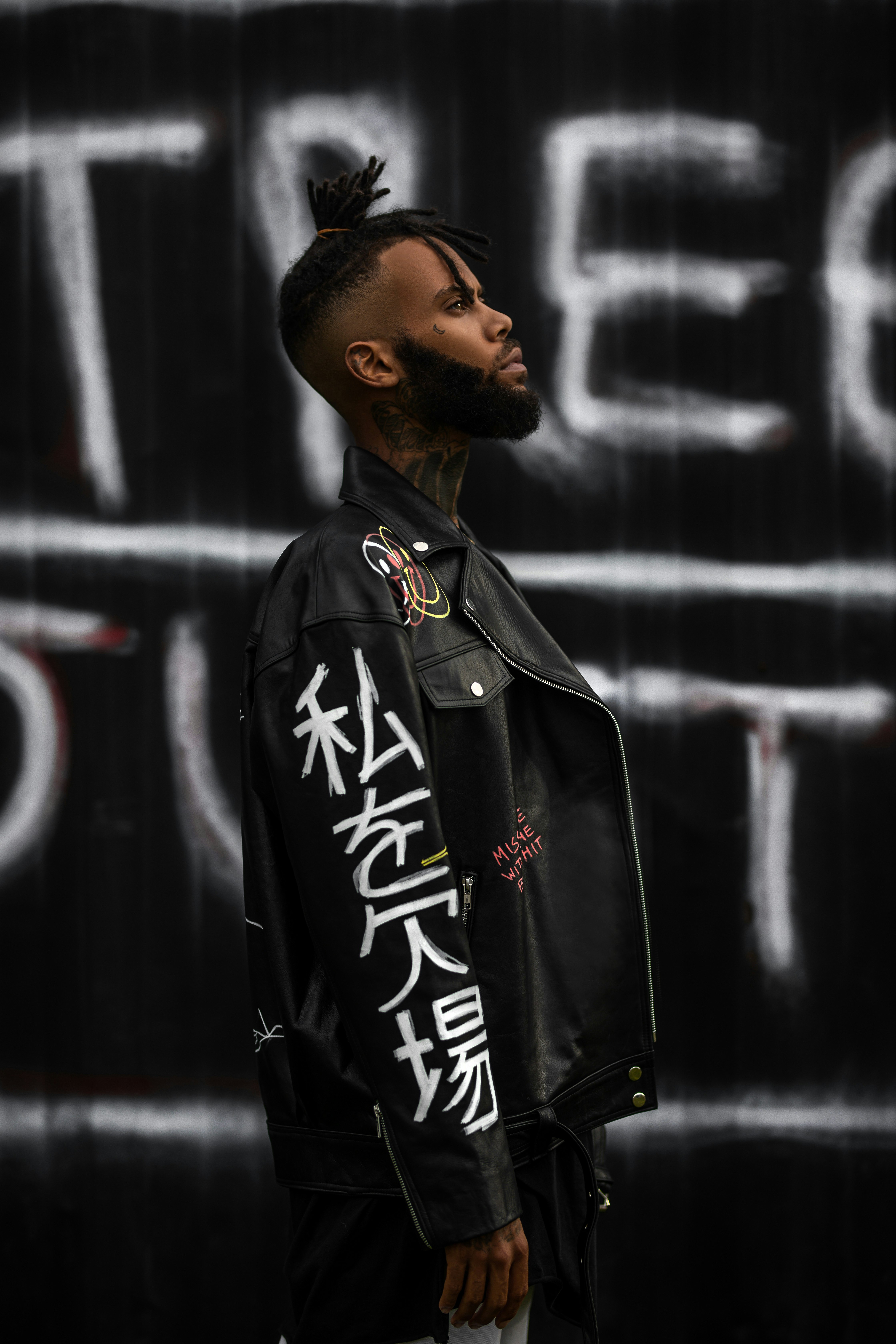 man in black and white zip up jacket