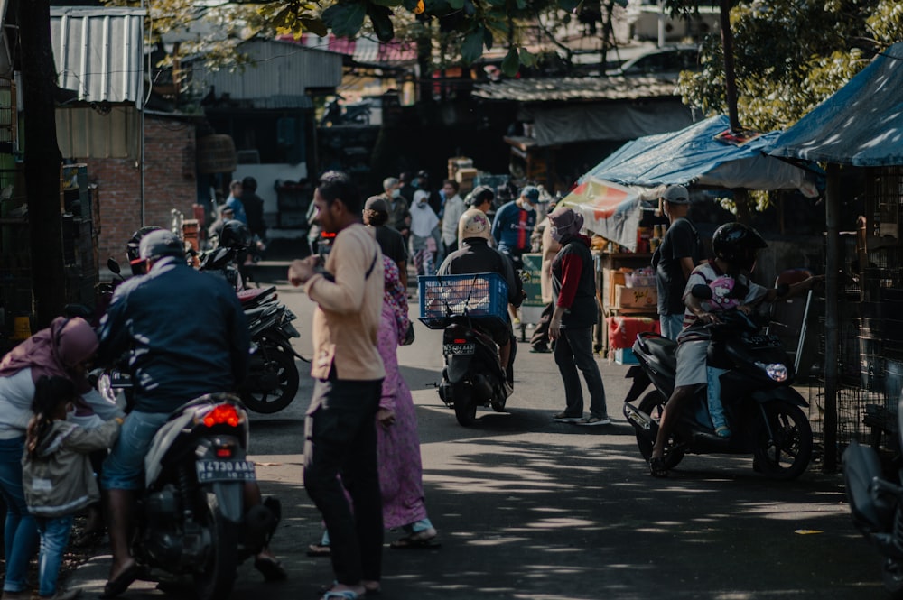 man in white shirt and purple pants standing on street