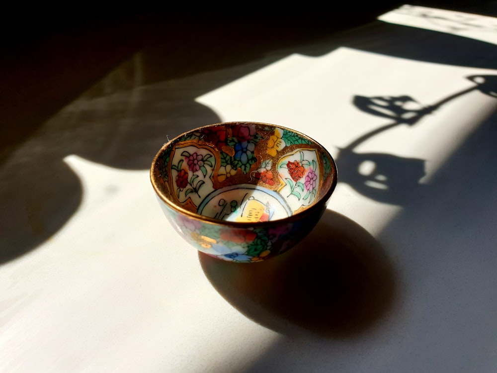 blue red and yellow ceramic bowl