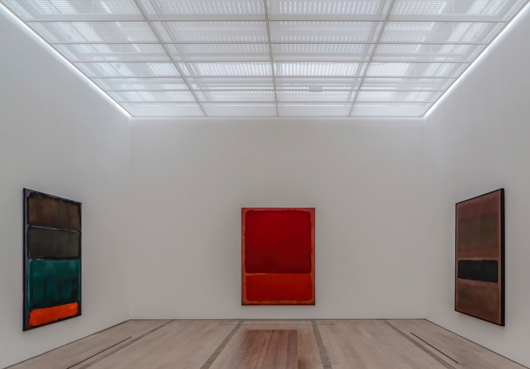 red wooden door on white wall