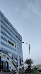 A modern office building representing Majloubi Group's investment focus.