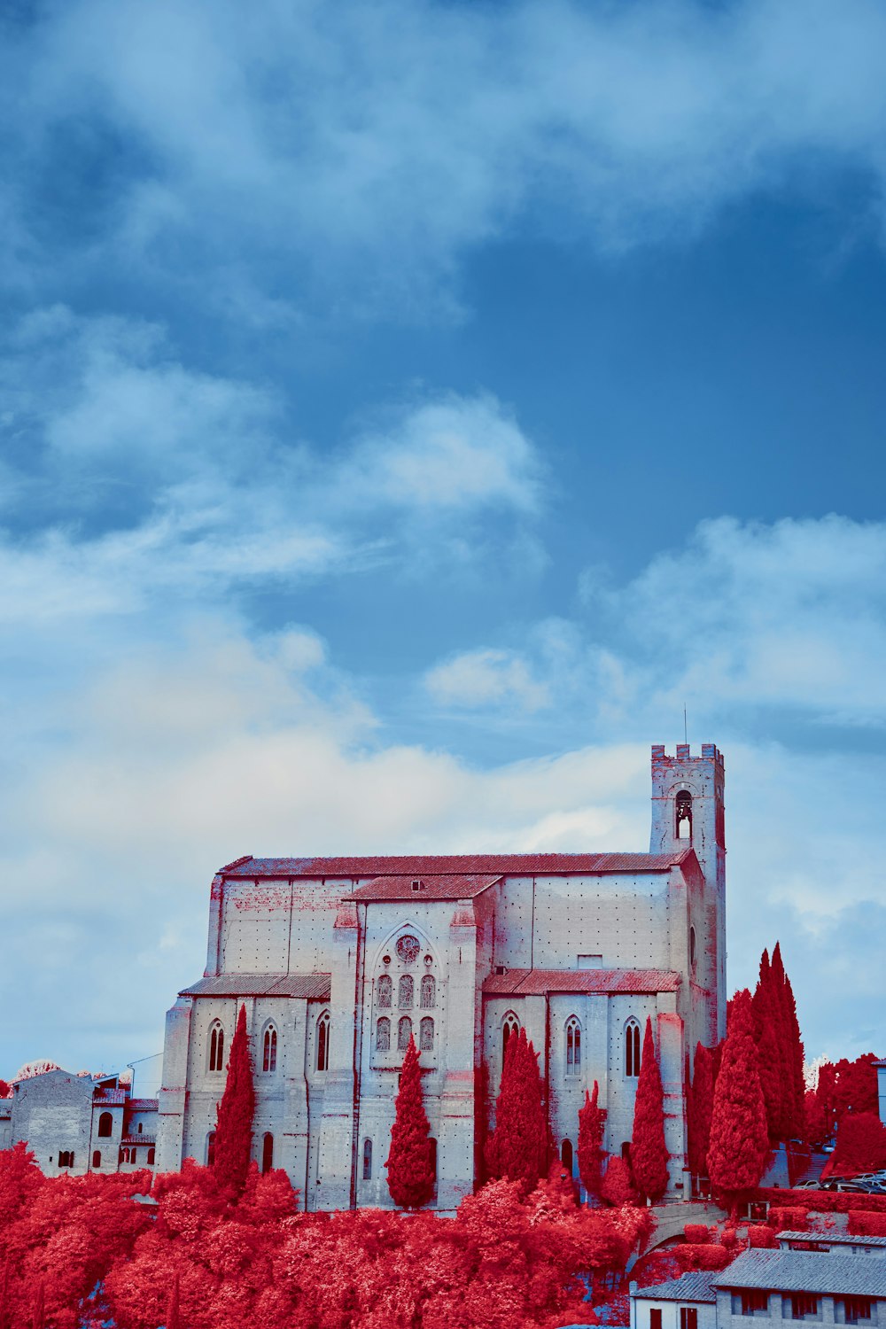 pink and white concrete building under blue sky during daytime