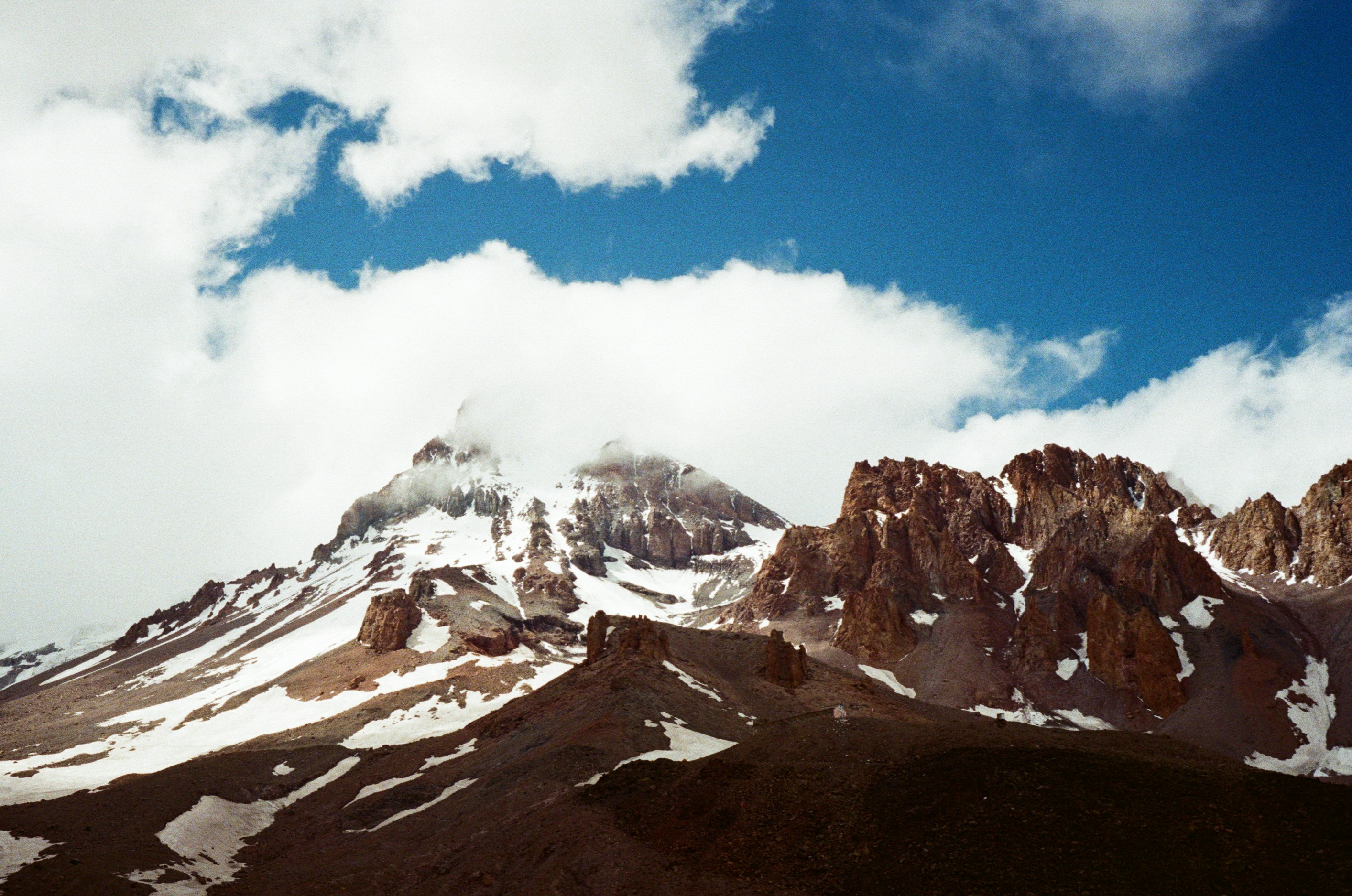 snow covered mountain under blue sky during daytime