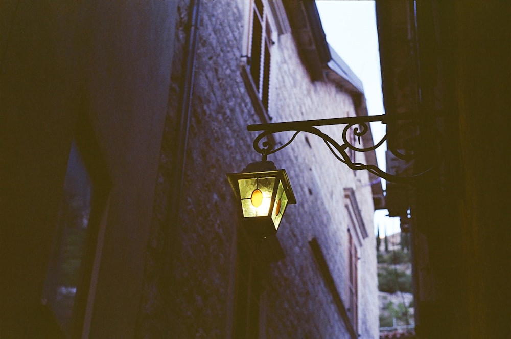 black sconce lamp on white concrete building during daytime