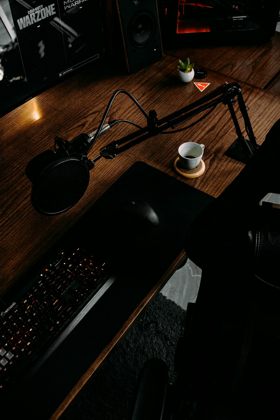 black headphones on black computer desk