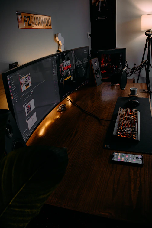 black flat screen computer monitor turned on beside black computer keyboard