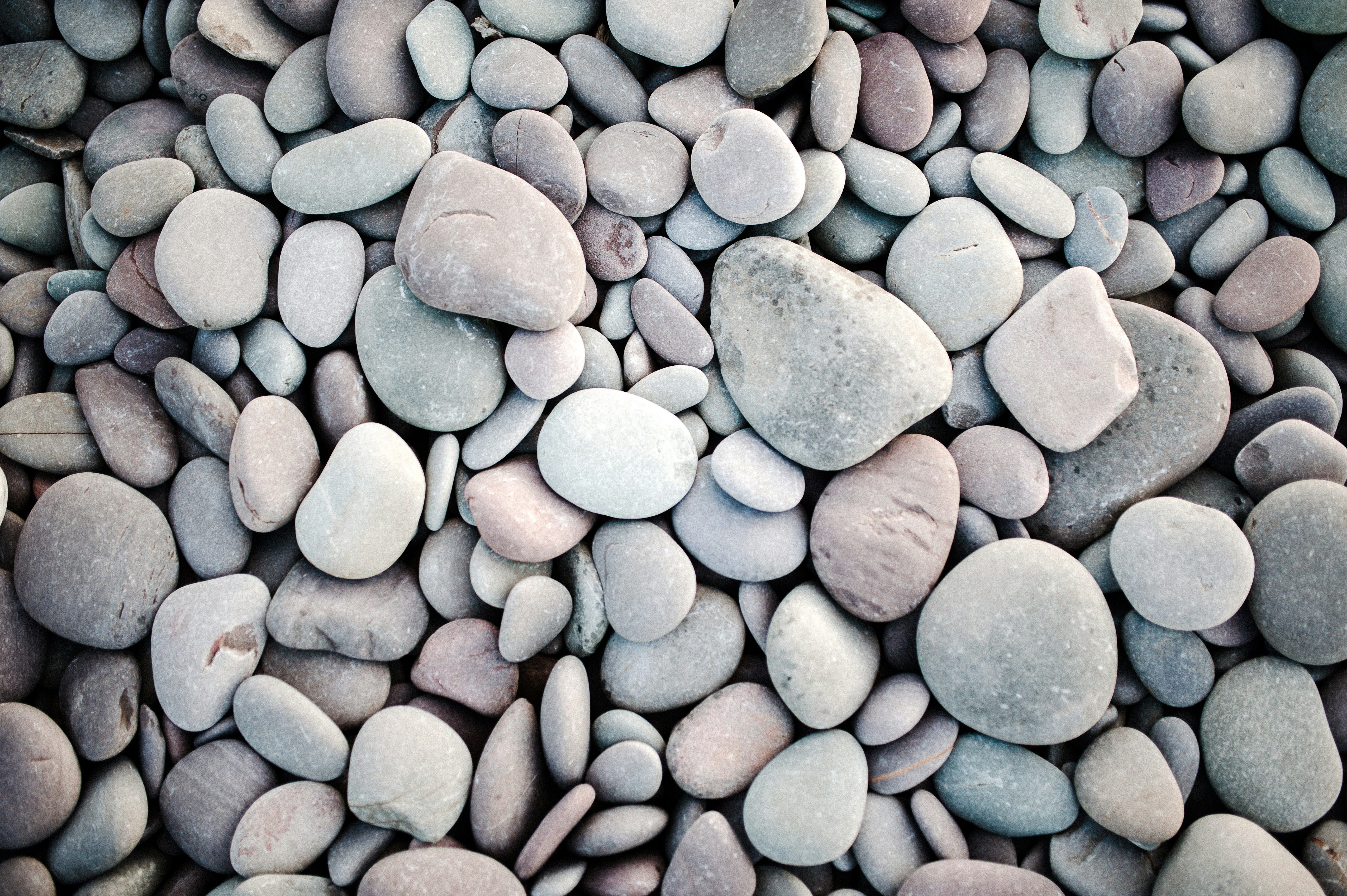 blue and gray stones on brown soil